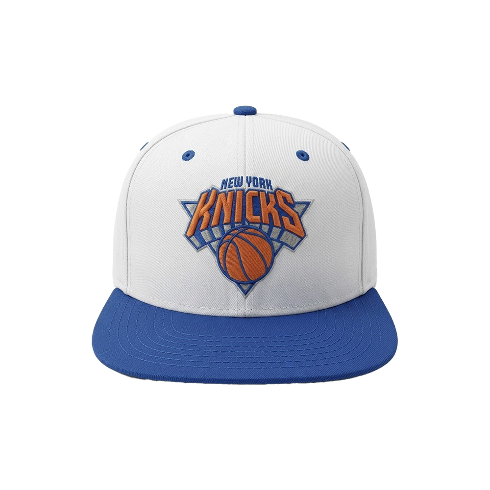 A white and blue New York Knicks snapback cap featuring the team logo embroidered on the front, set against a plain white background.
