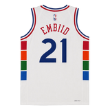 White Philadelphia 76ers basketball jersey with 'EMBIID' and number '21' on the back, featuring red, blue, and multicolor side stripe details.