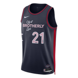 A navy blue Nike basketball jersey with red and white accents, featuring the text 'City of BROTHERLY Love' and the number '21' on the front, shown against a plain white background.